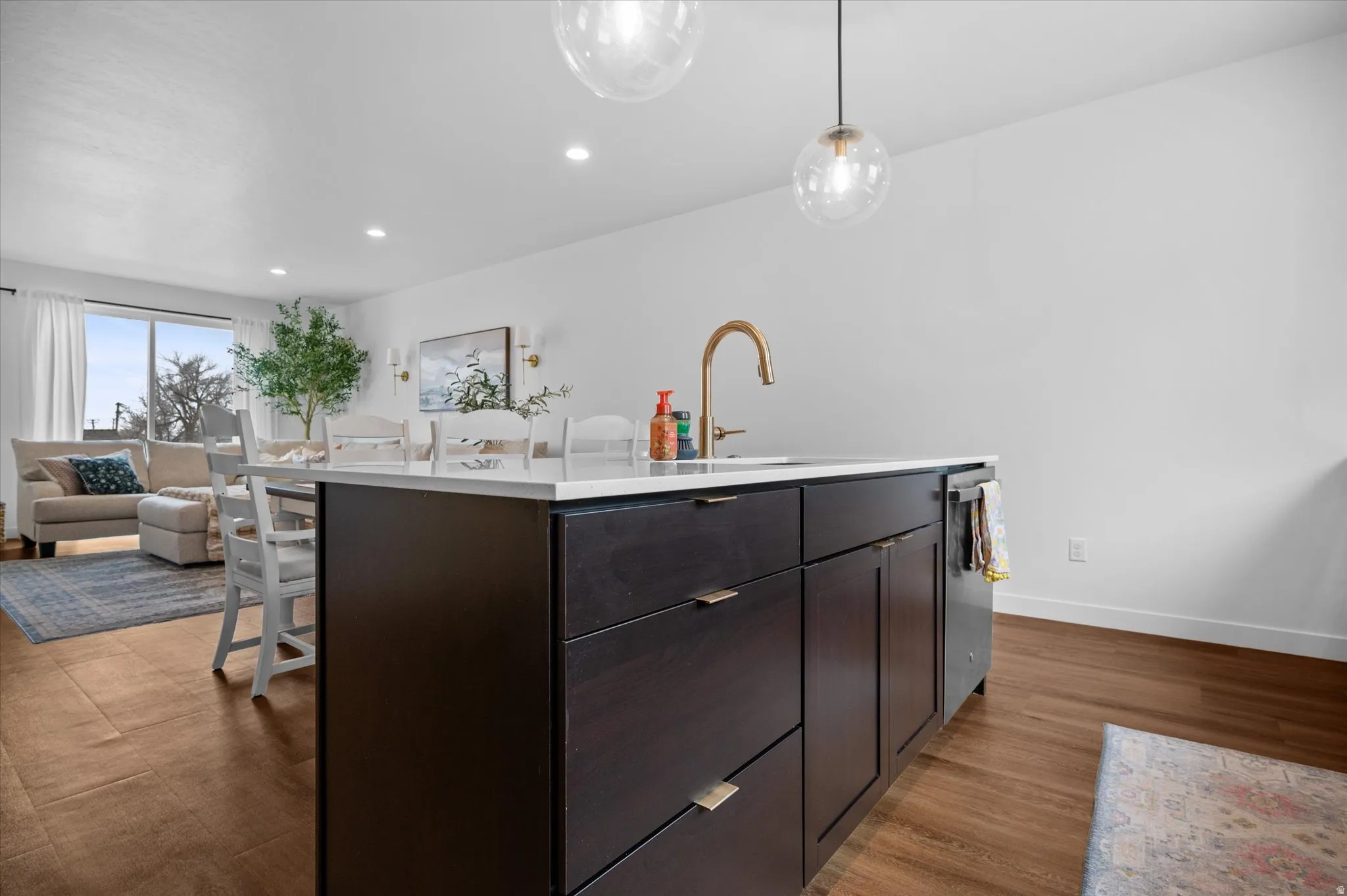 Solid wood kitchen island with quartz countertop.