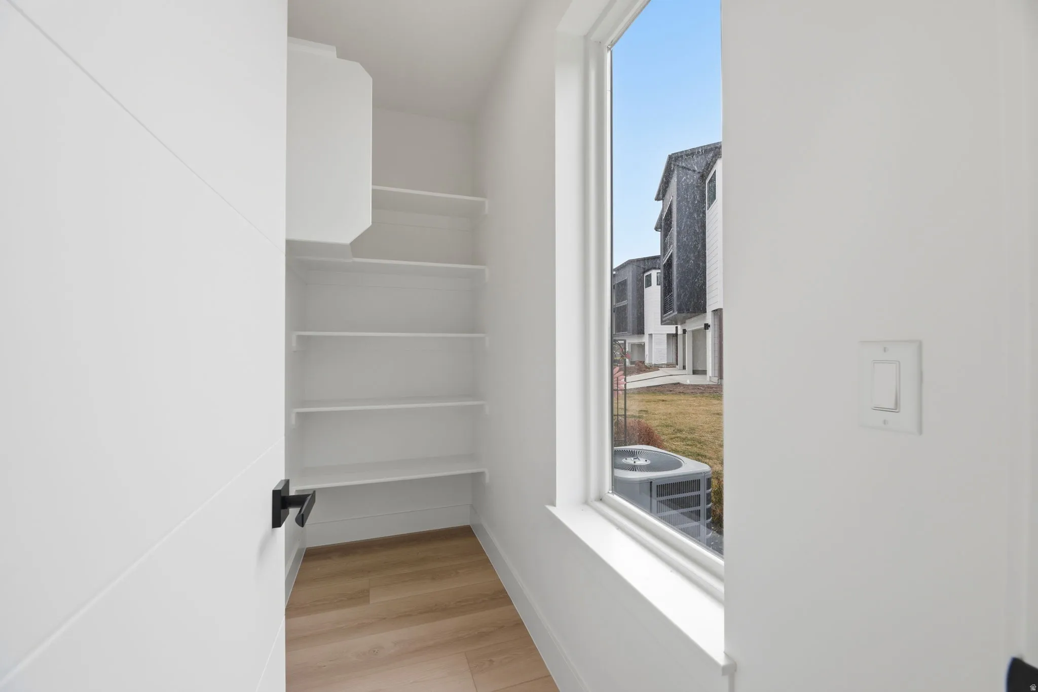 Walk in closet featuring light wood-type flooring