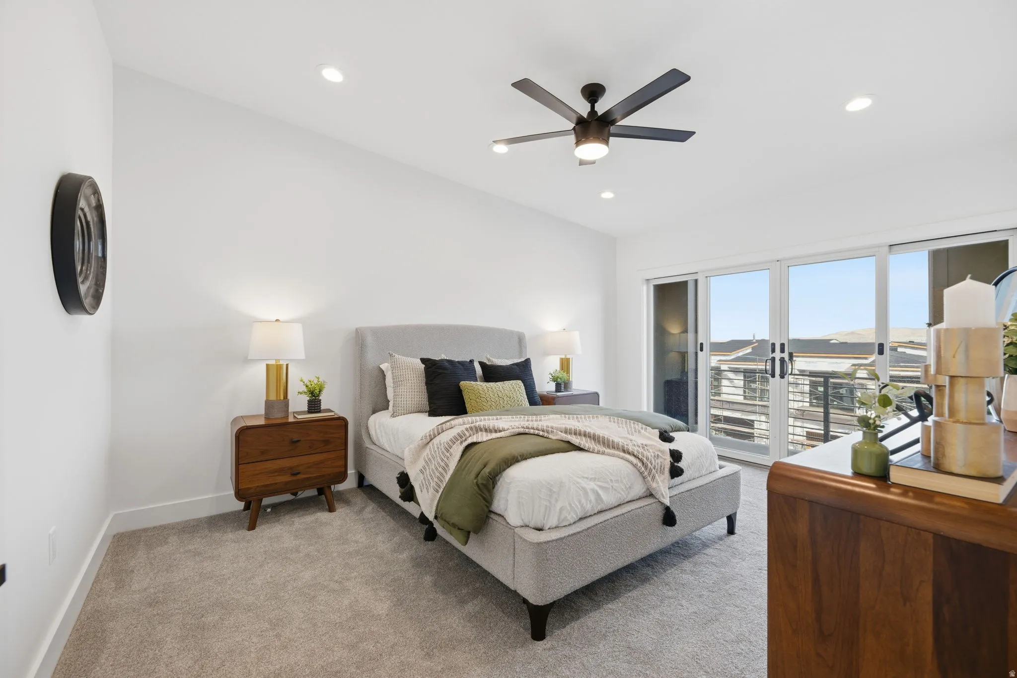 Bedroom featuring light colored carpet, ceiling fan, recessed lighting, and access to exterior