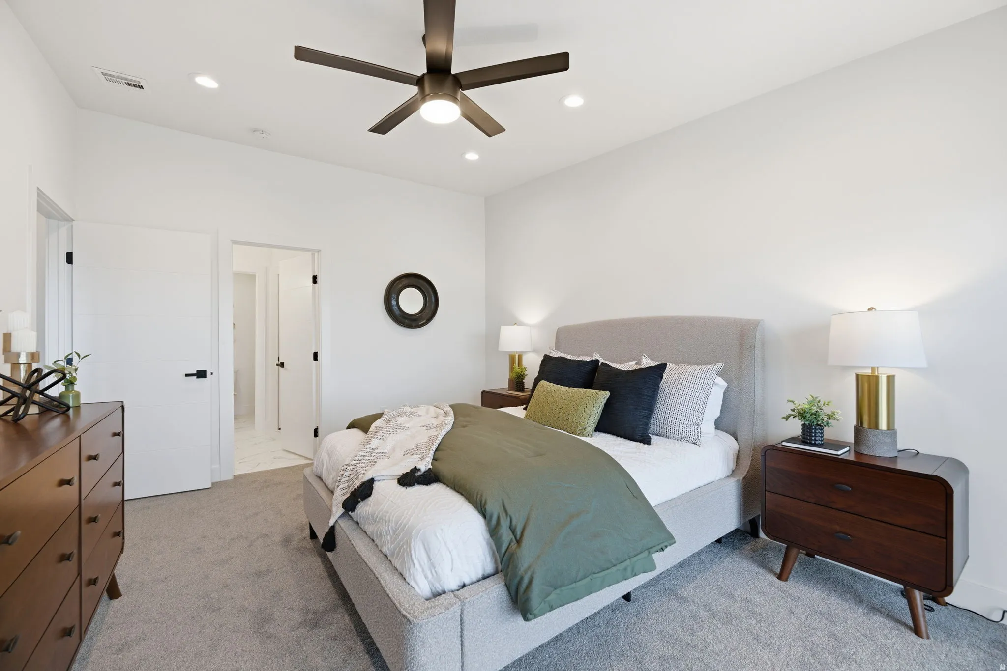 Bedroom featuring light carpet, ceiling fan, and recessed lighting