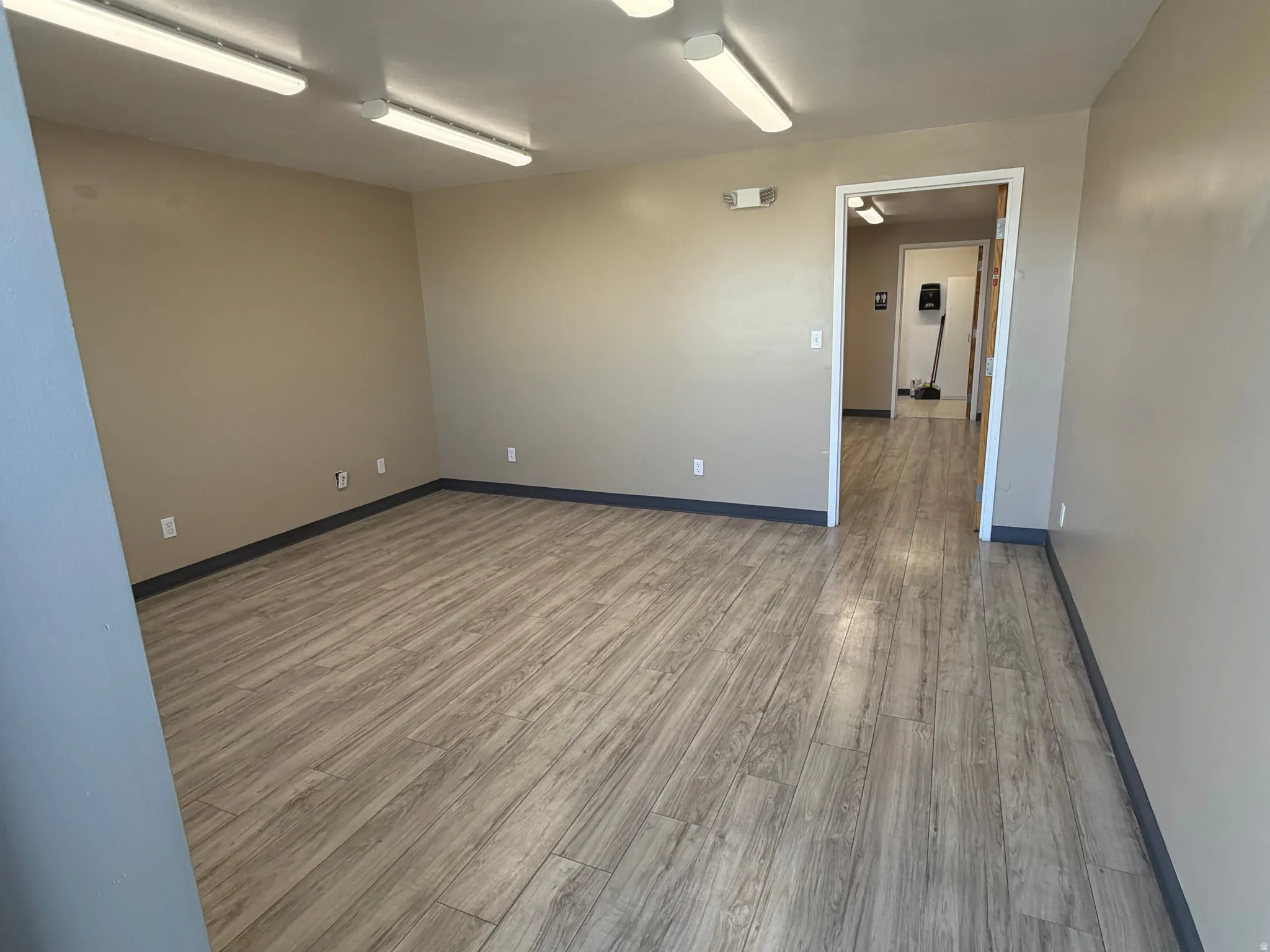 Empty room with wood finished floors and baseboards
