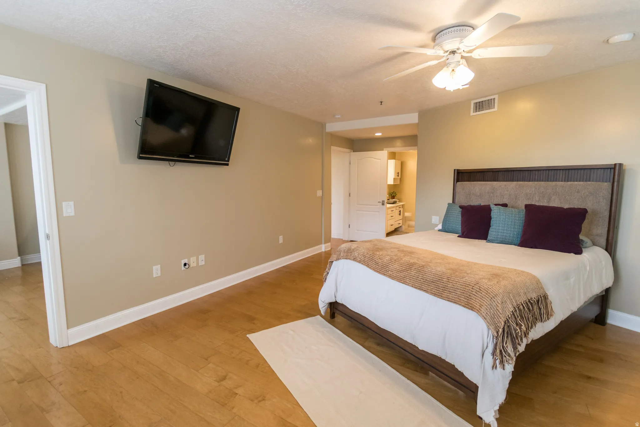 Bedroom with light wood-type flooring and ceiling fan