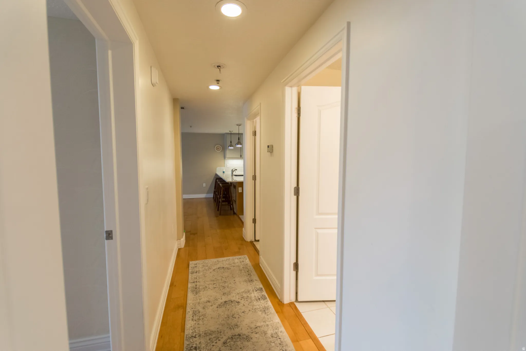 Corridor featuring recessed lighting and light wood-style floors