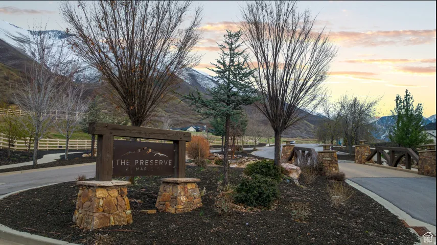Community sign featuring a mountain view