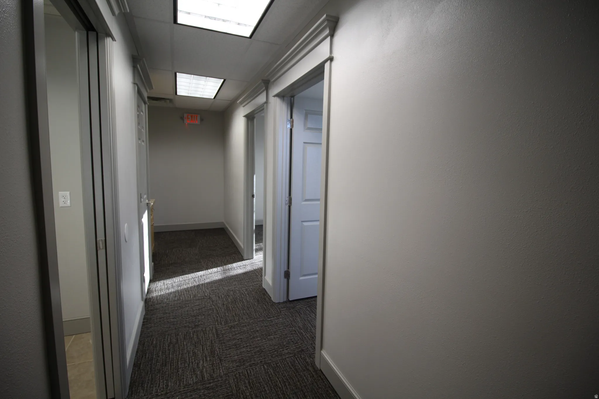 Wide hall leads to 3 offices