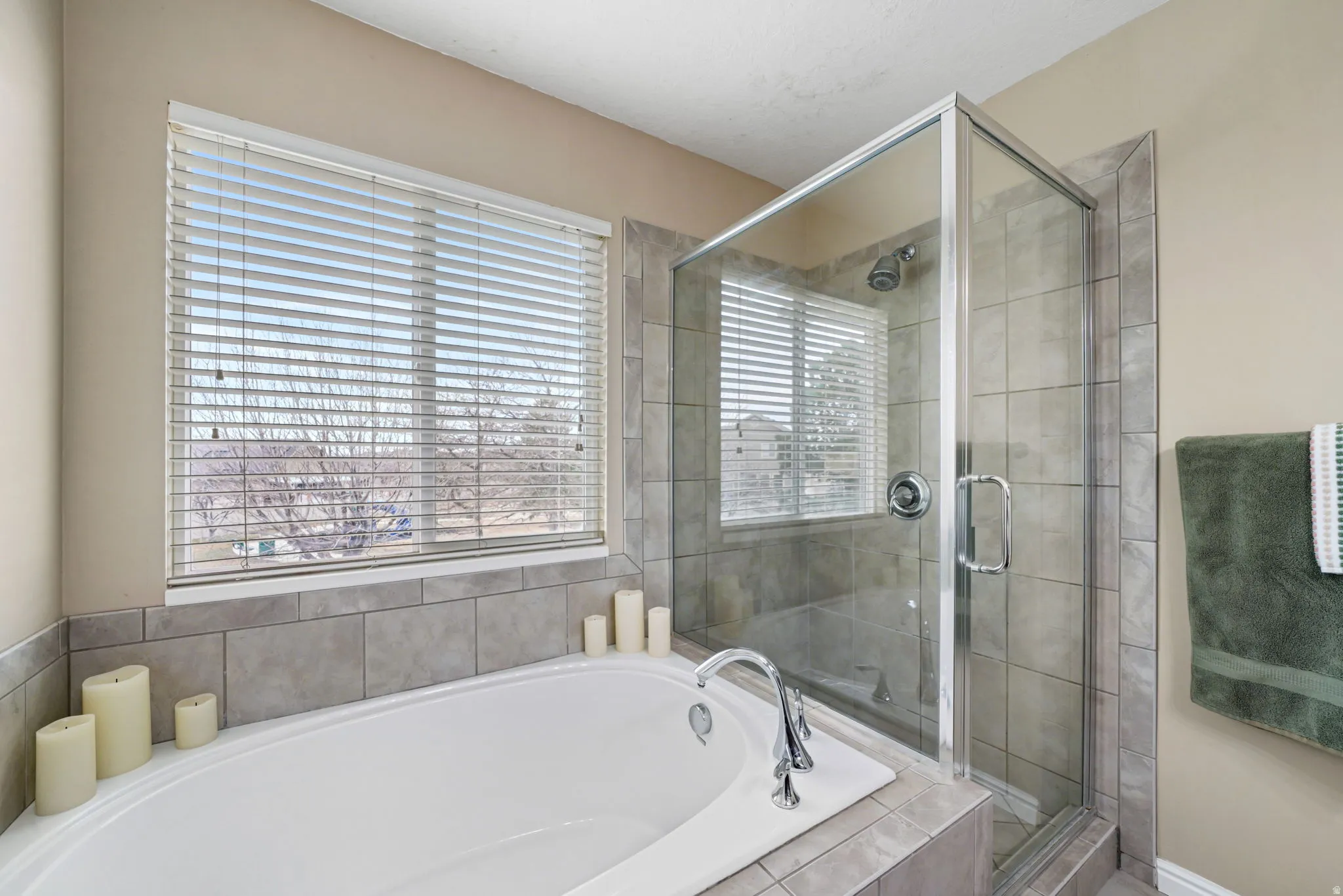 Bathroom featuring a bath and a stall shower
