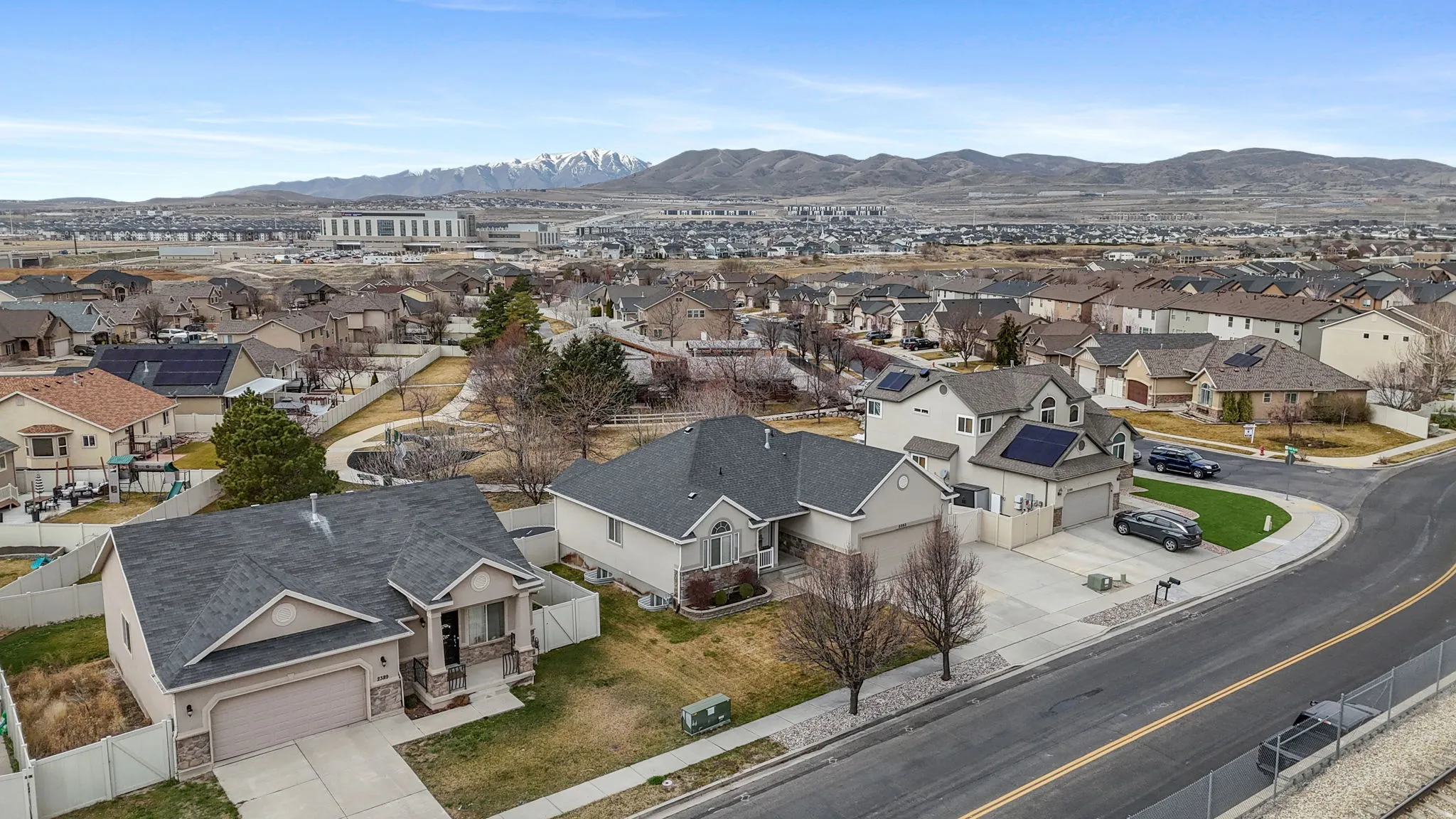 Aerial view of residential area featuring a mountain backdrop