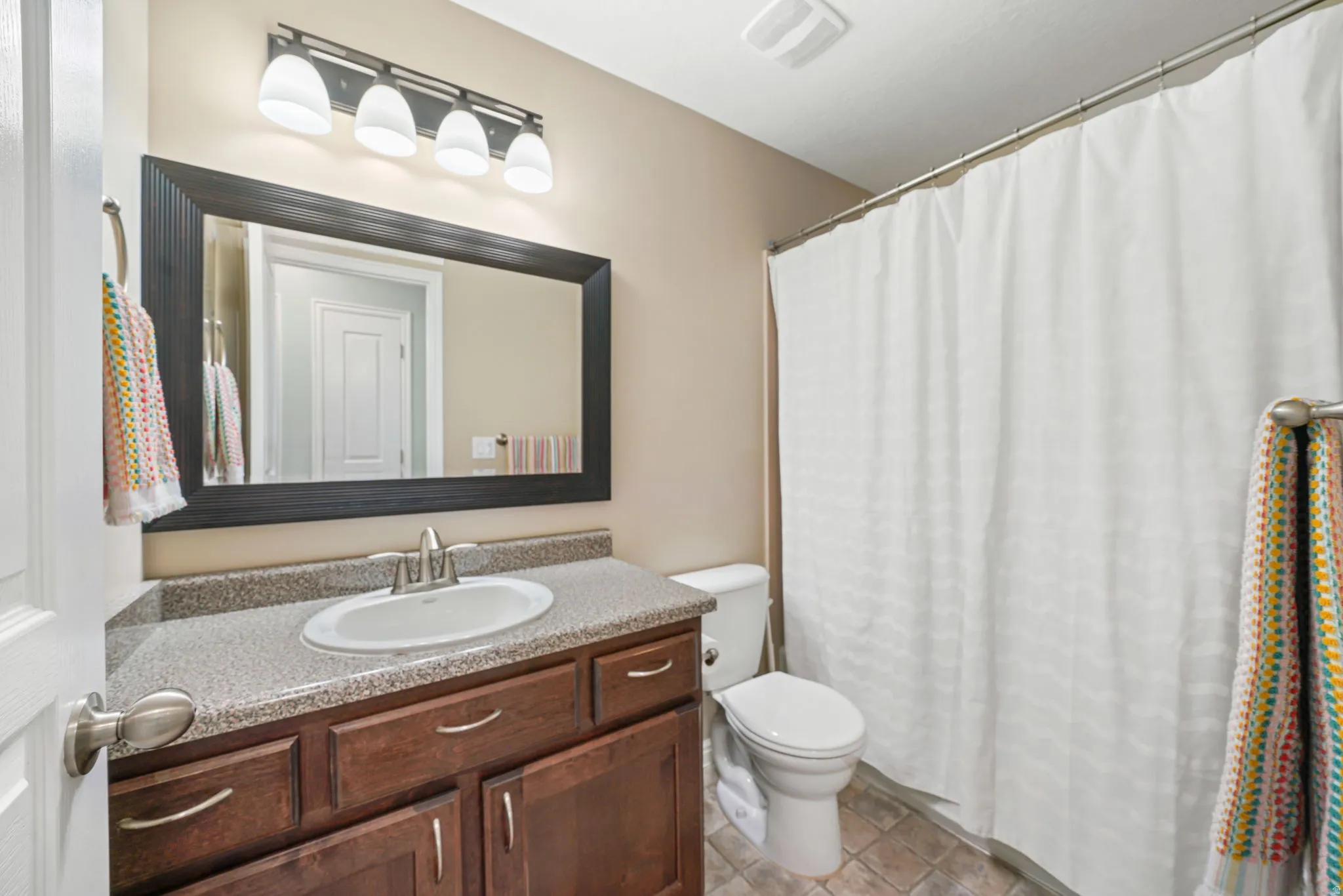 Bathroom with vanity and a shower with curtain