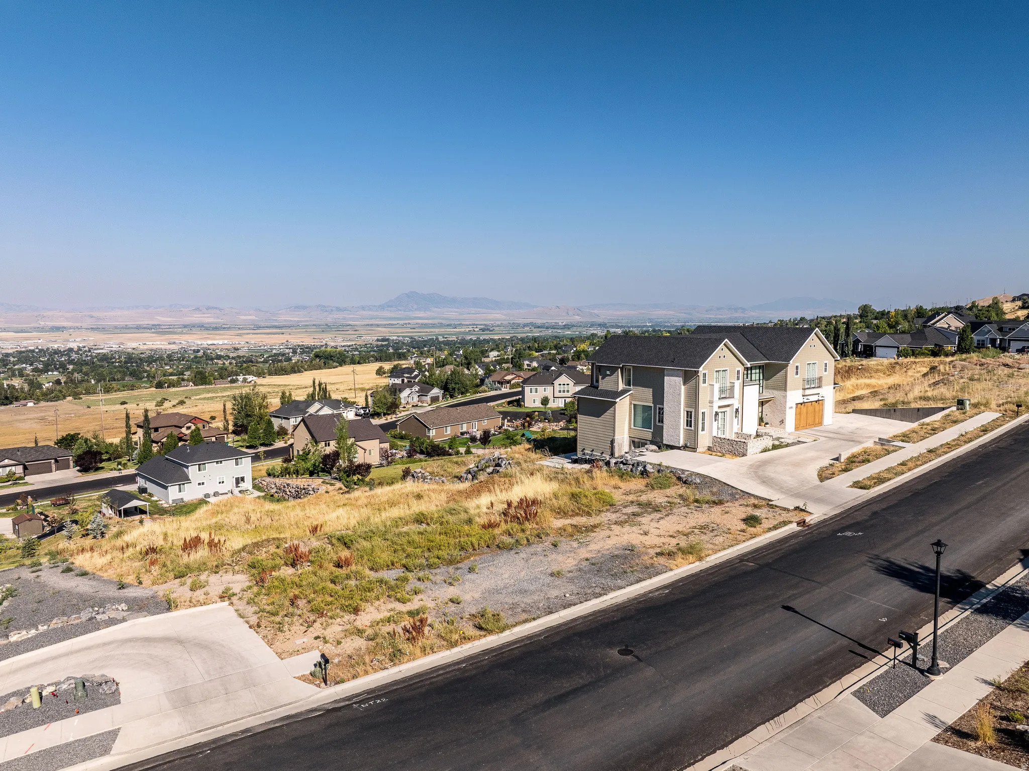 View of mountain backdrop featuring nearby suburban area
