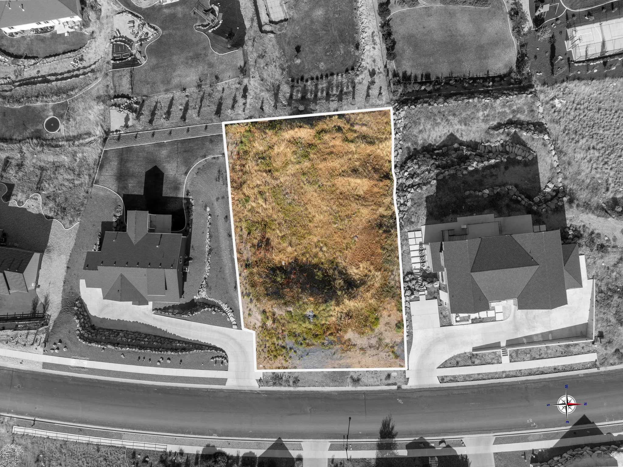 Aerial view of property and surrounding area featuring property parcel outlined