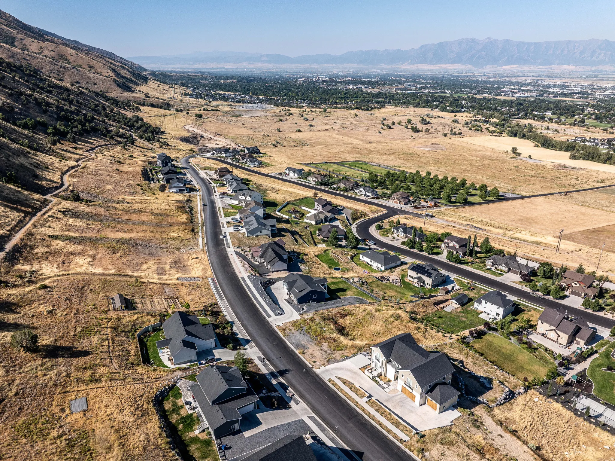 View of property location with a mountain backdrop, rural landscape, and nearby suburban area