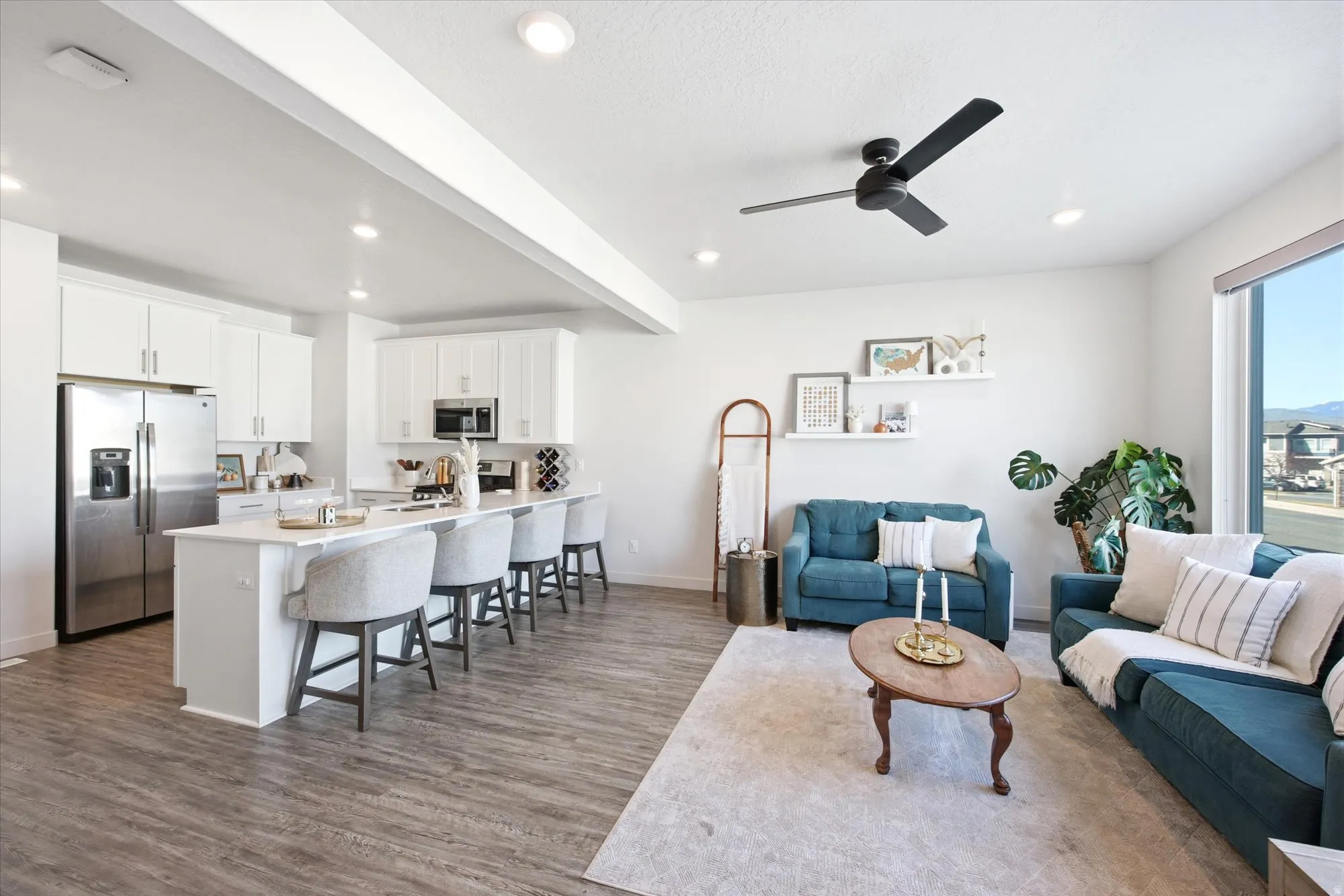 Living area featuring a ceiling fan, dark wood finished floors, and recessed lighting