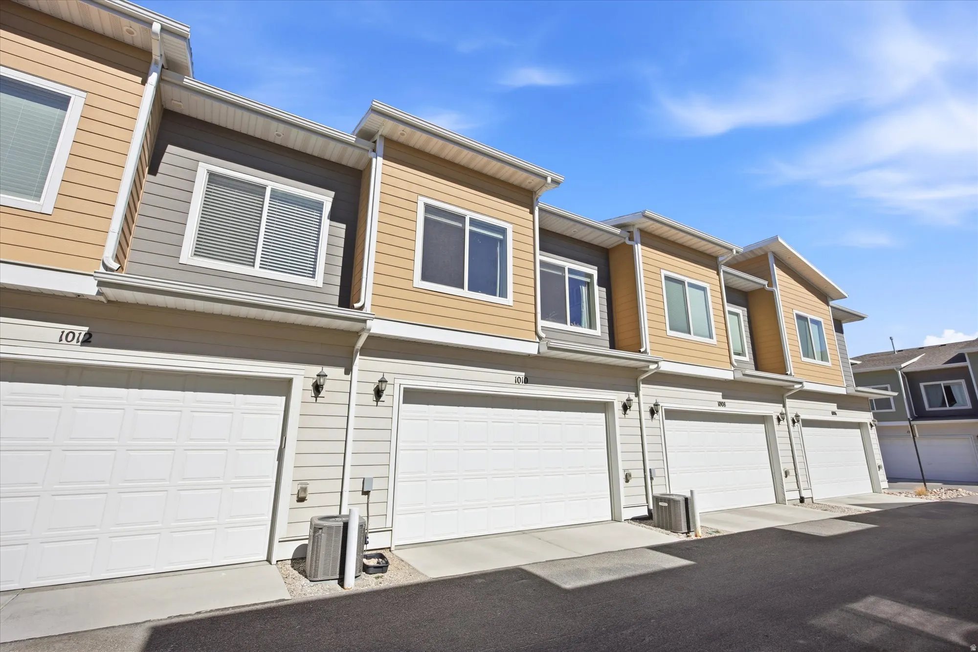View of front of property with a residential view and an attached garage