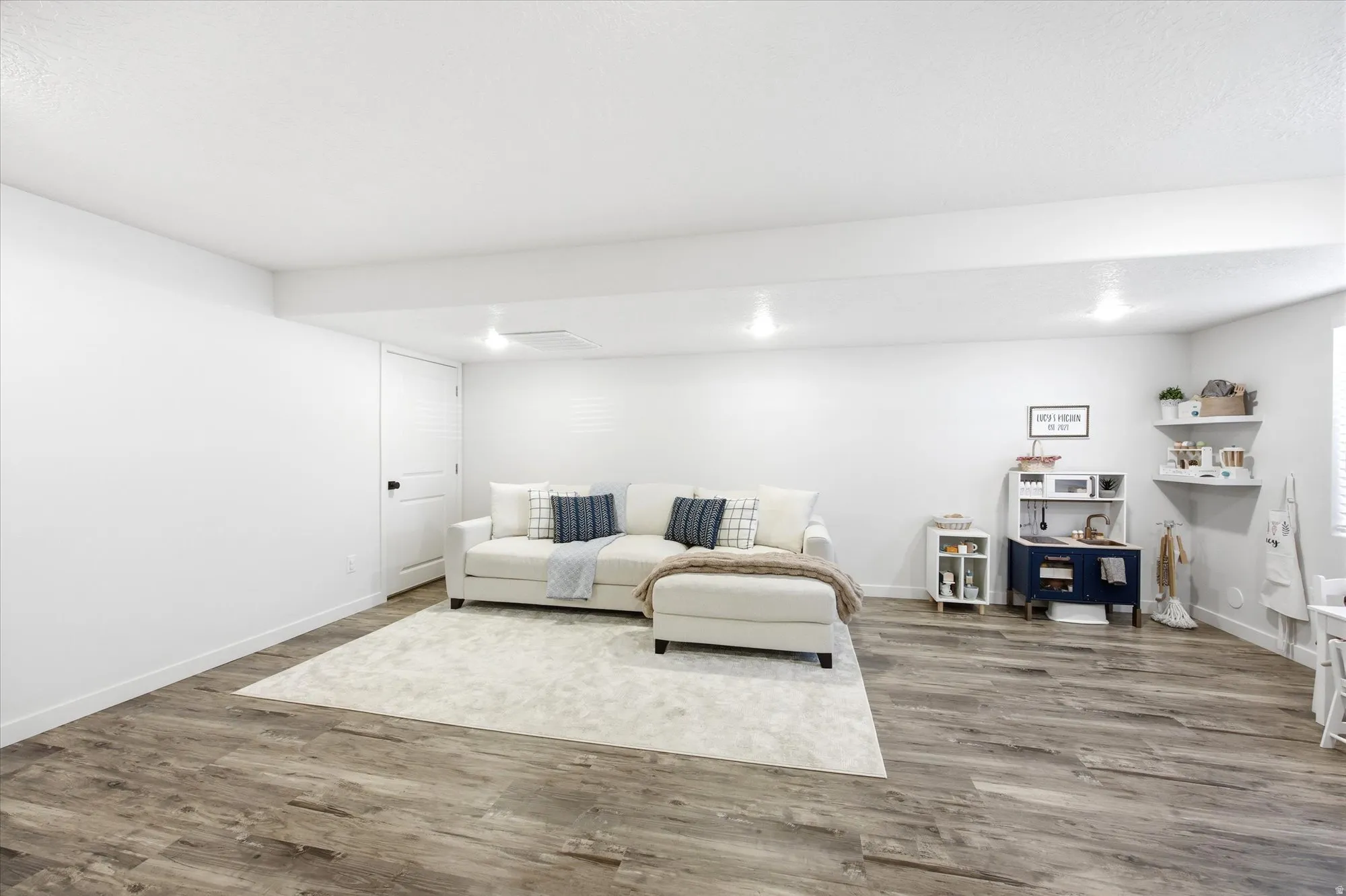 Living area featuring wood finished floors and baseboards