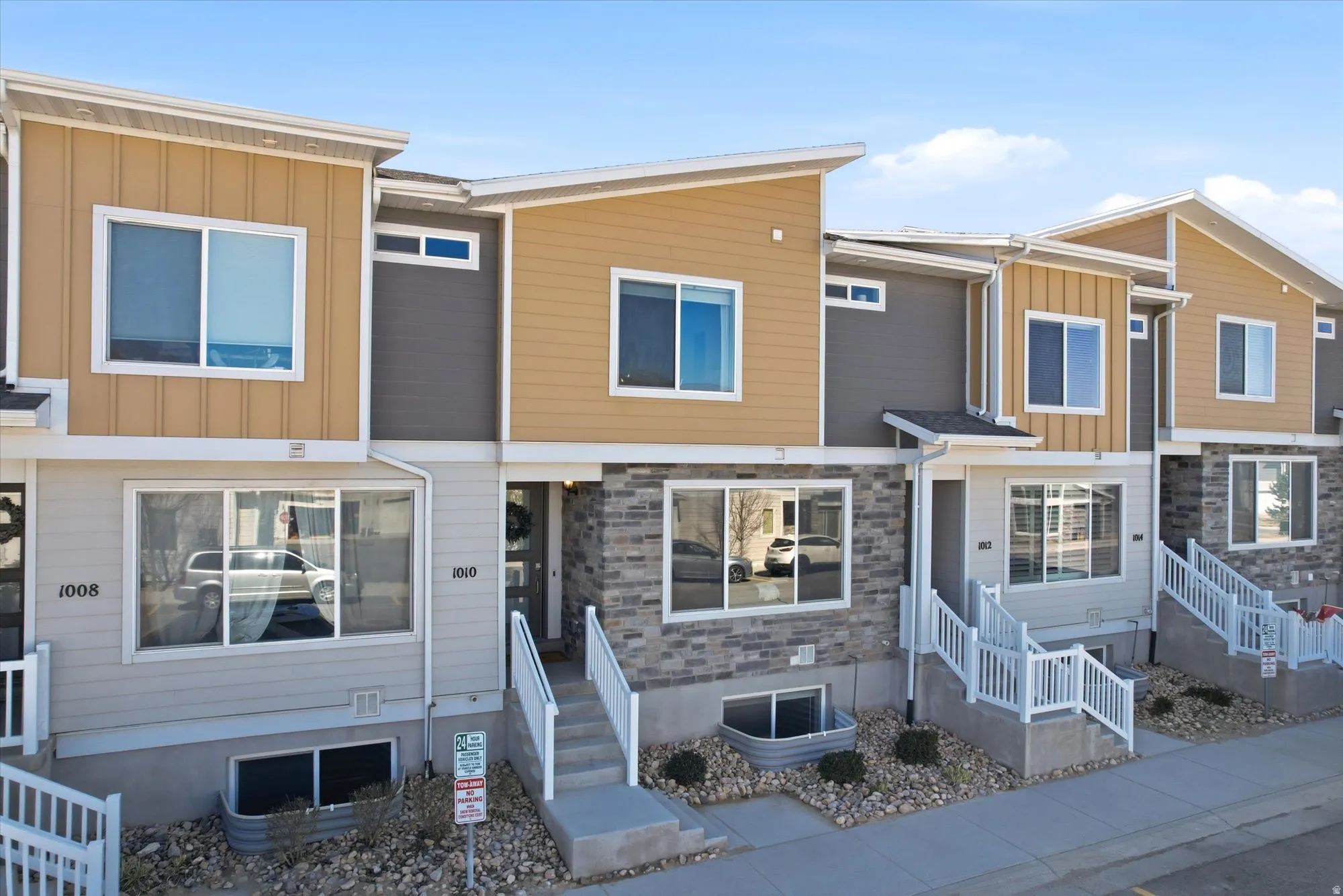 View of front of property featuring board and batten siding and stone siding
