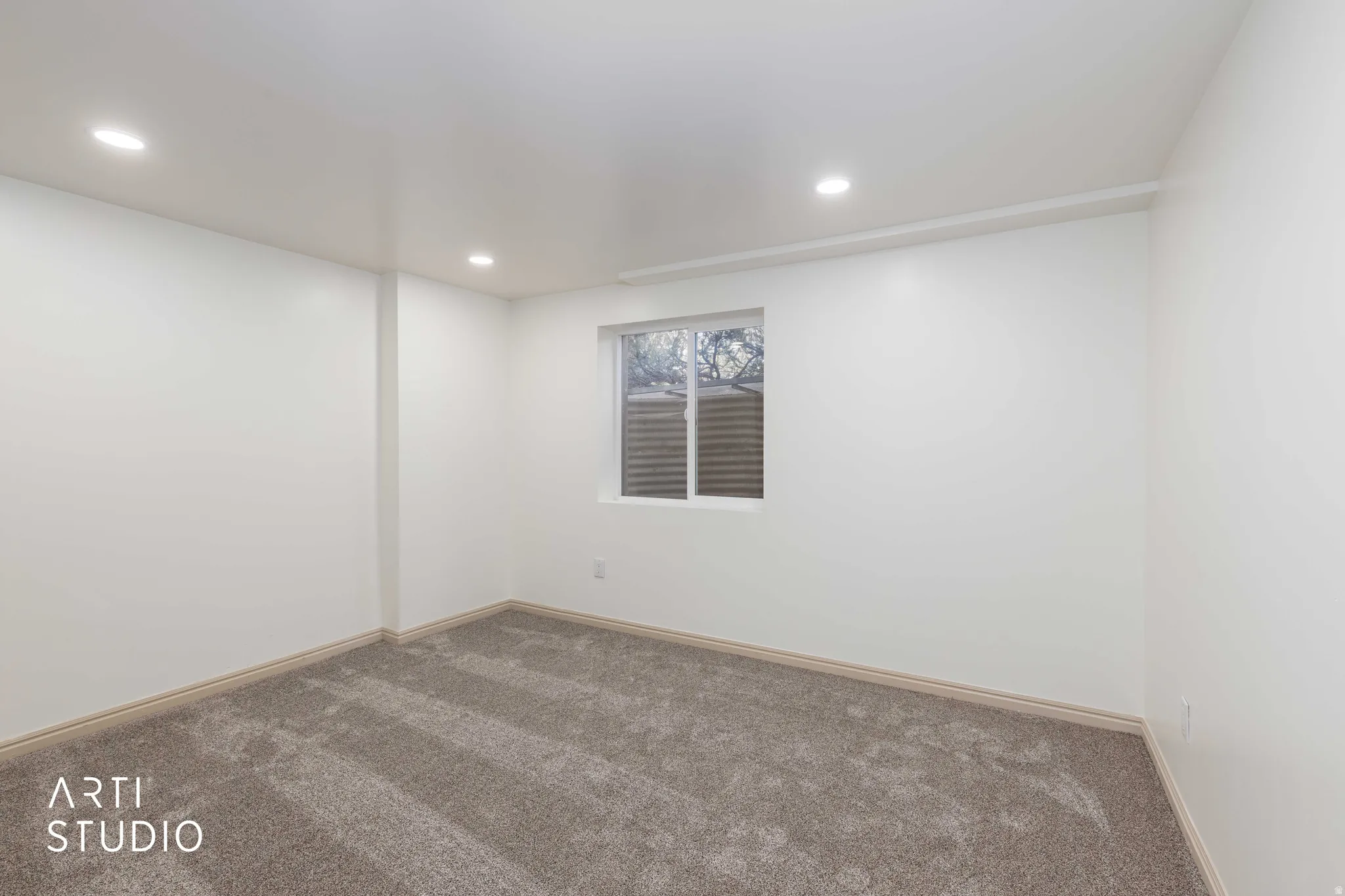 Unfurnished room featuring carpet and recessed lighting