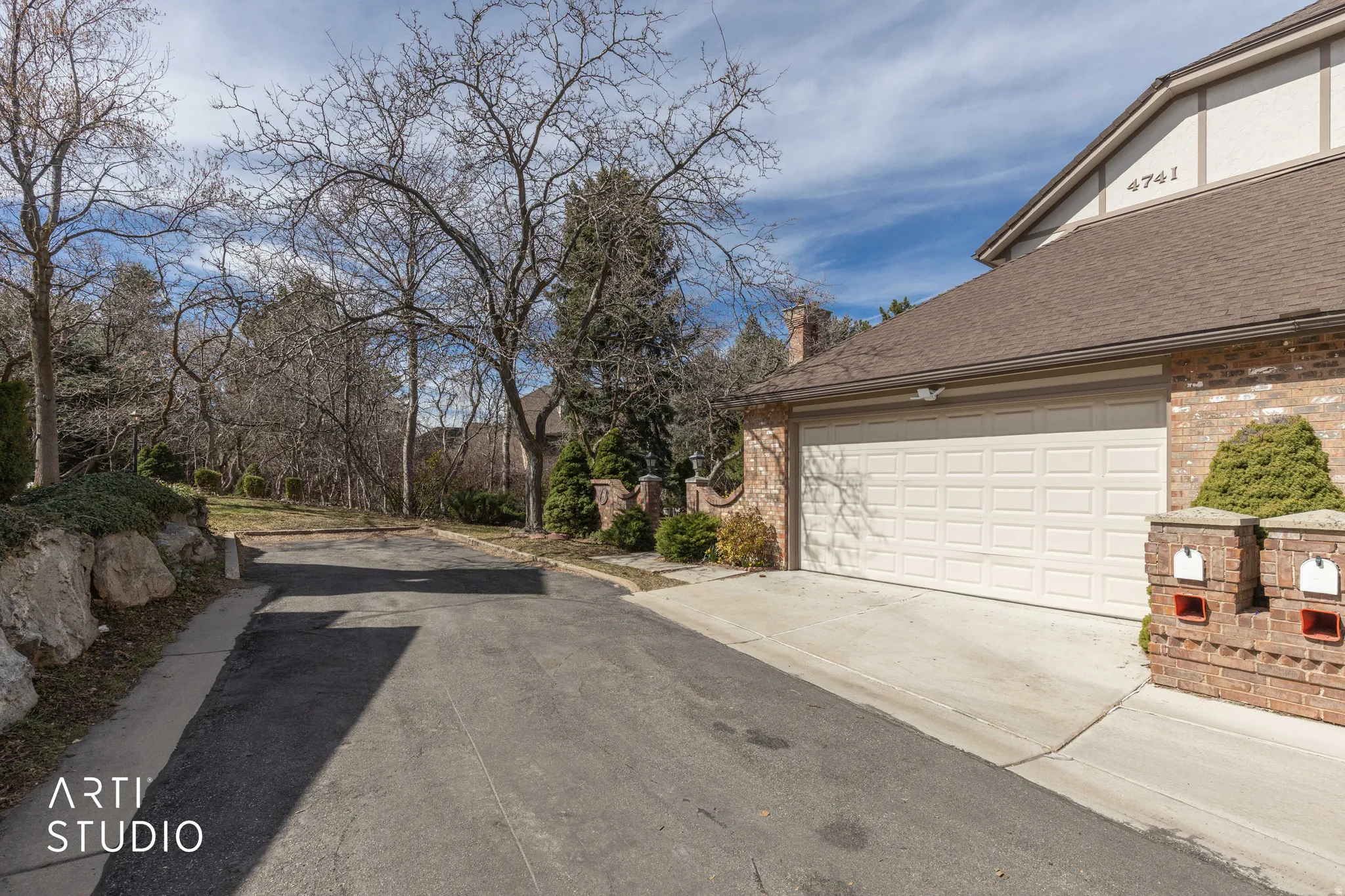 Garage featuring driveway & guest parking