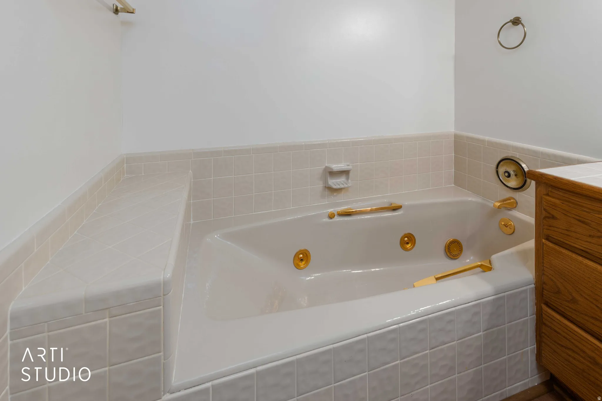 Full bath with a jetted tub and vanity