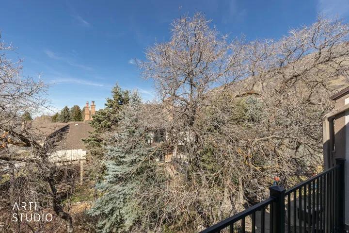 View of yard featuring a balcony