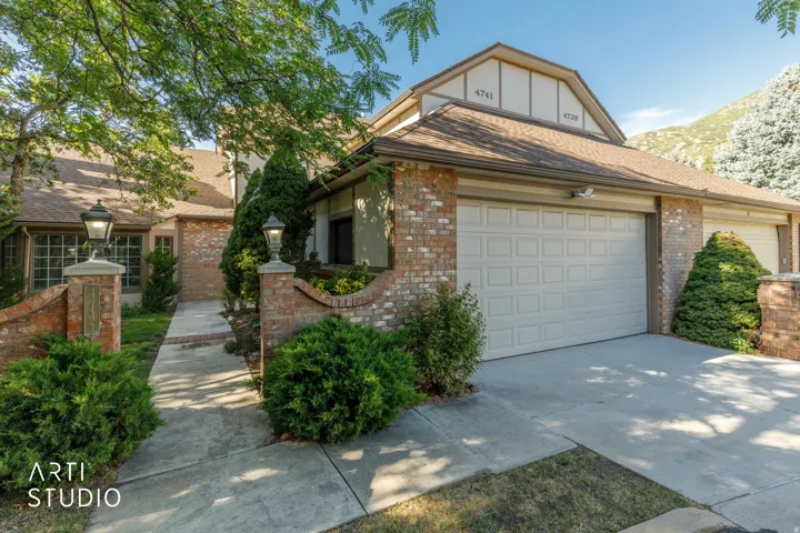 Brick exterior with an attached two-car garage