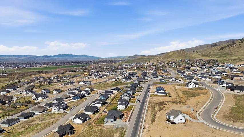 Aerial perspective of suburban area with a mountainous background