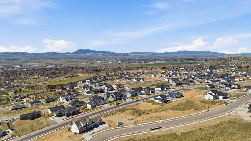 Aerial perspective of suburban area with a mountain backdrop