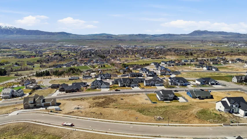 Aerial perspective of suburban area featuring a mountainous background