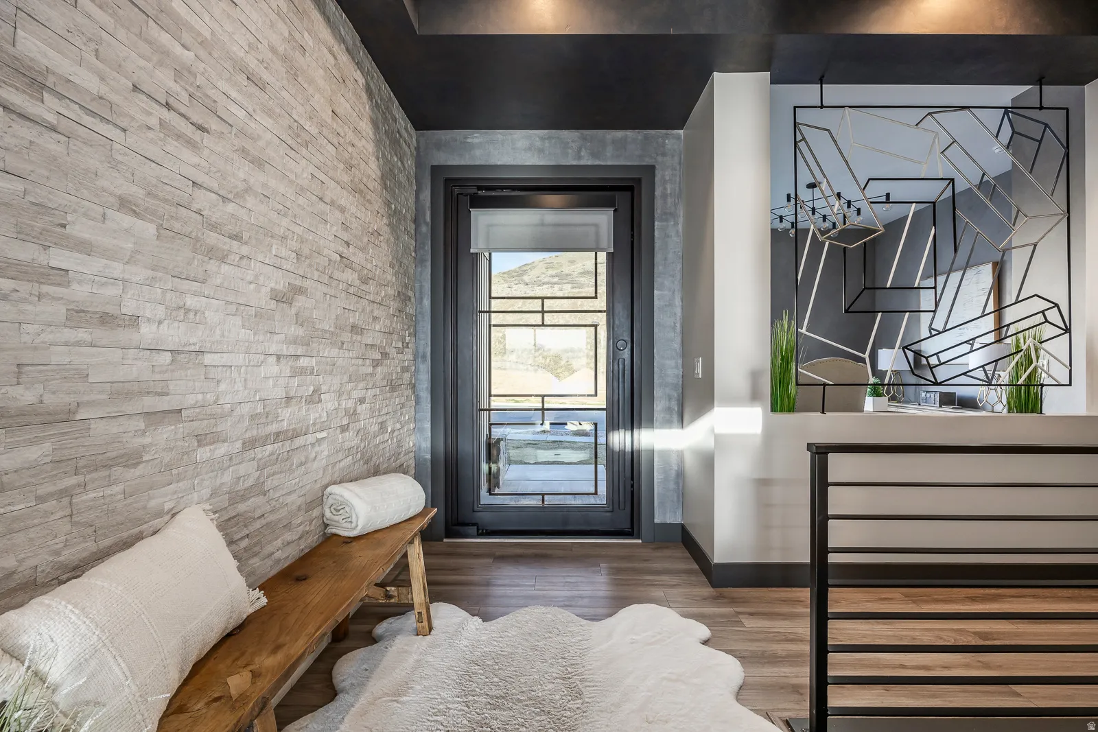Entryway featuring wood finished floors and baseboards