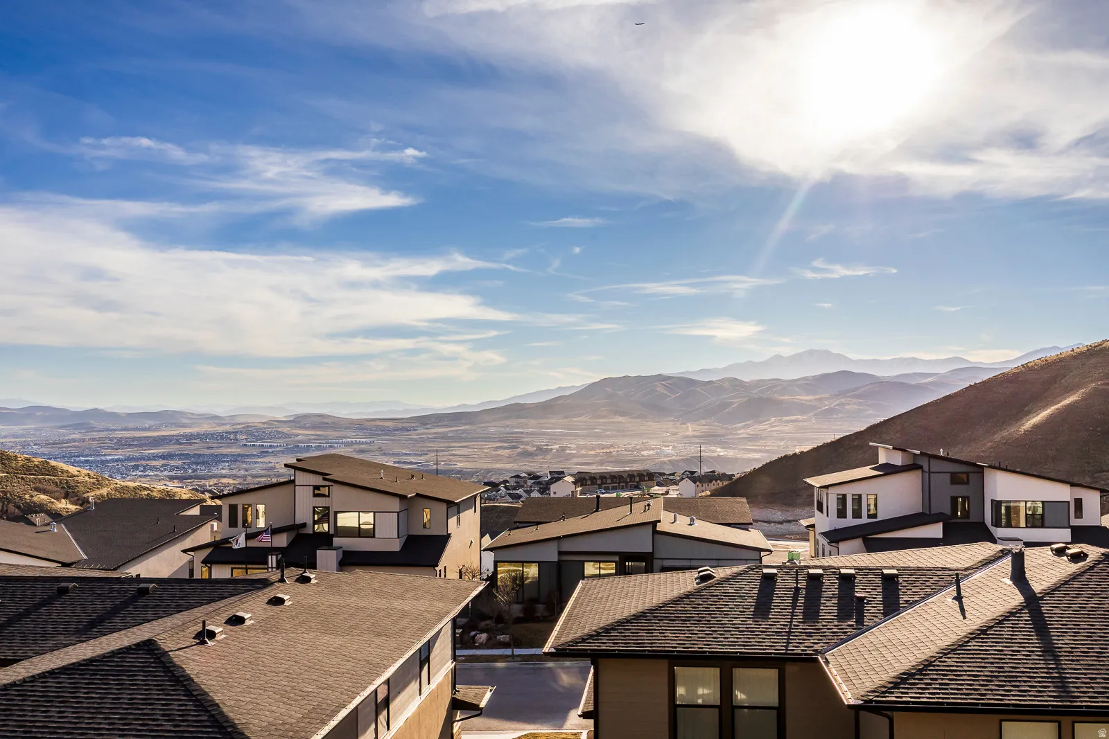 View of mountain background featuring nearby suburban area