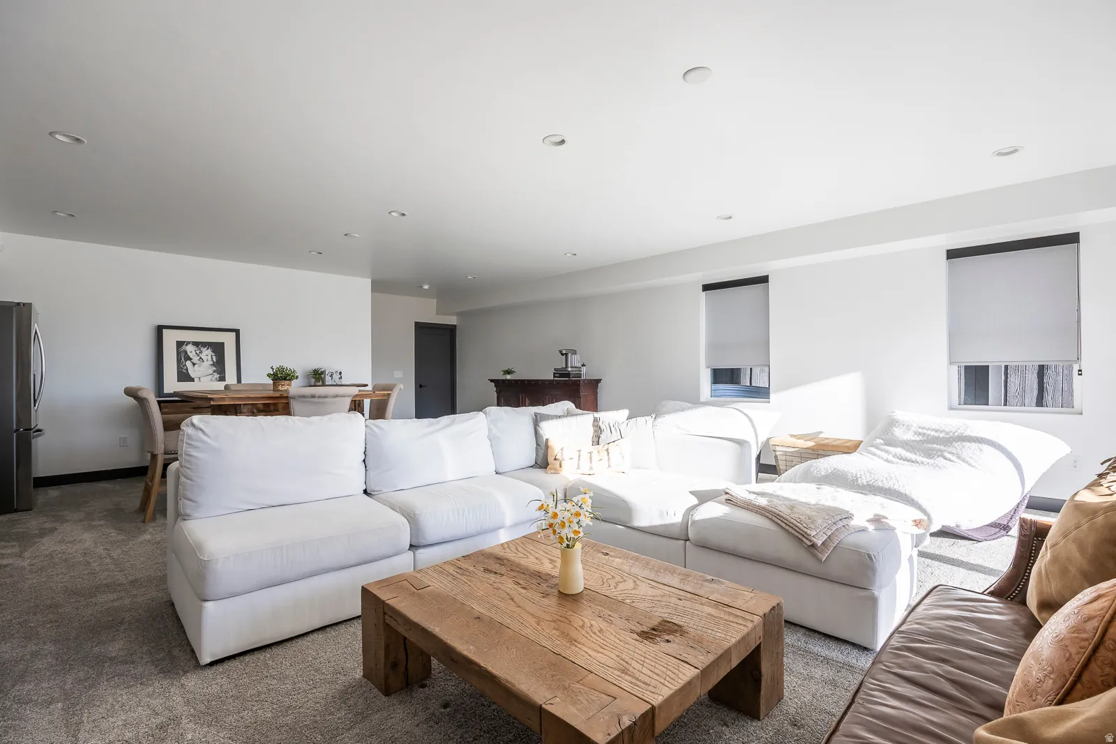 Living area with carpet flooring and recessed lighting