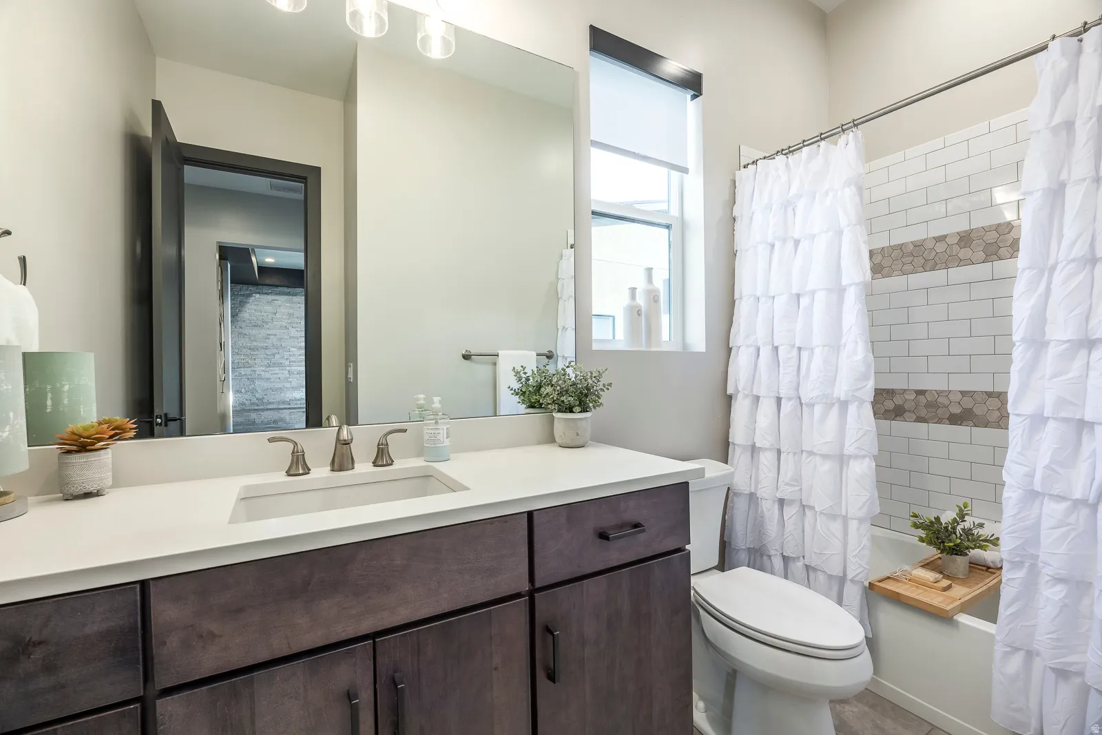 Full bathroom with vanity and shower / bath combo with shower curtain