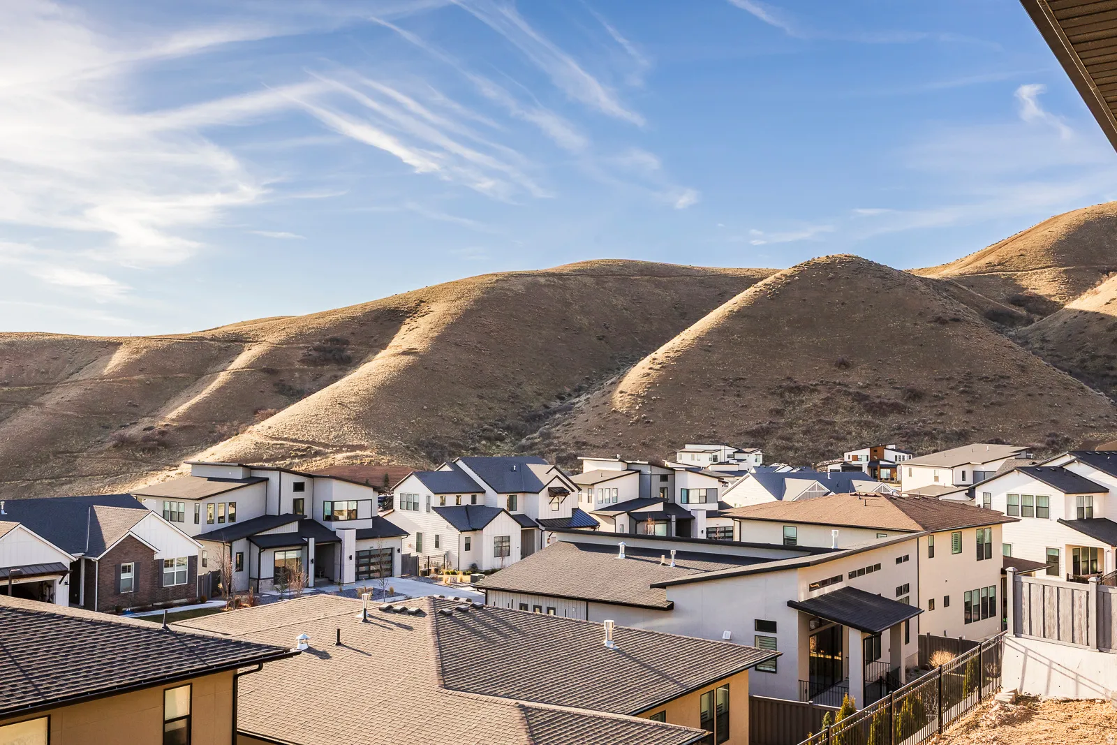 View of mountain background featuring nearby suburban area