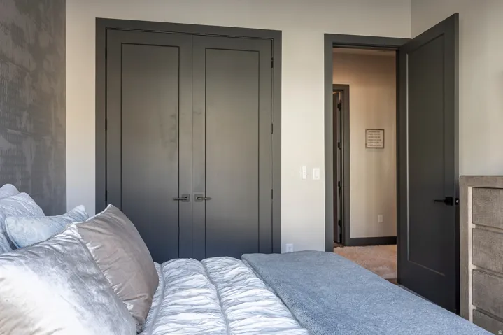 Bedroom with a closet and baseboards