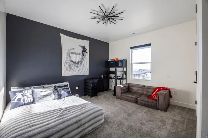 Bedroom with carpet floors and baseboards