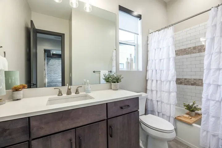 Full bathroom with vanity and shower / bath combo with shower curtain