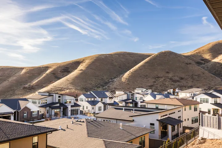 View of mountain background featuring nearby suburban area