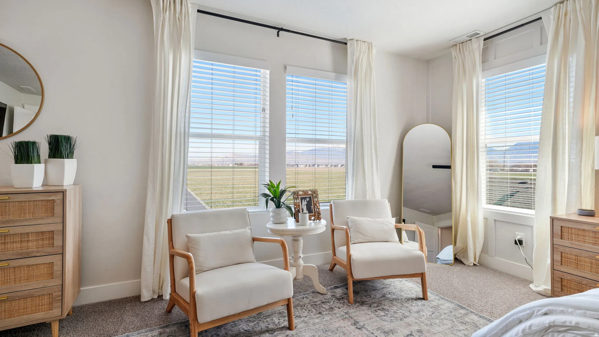 Bedroom with light carpet and baseboards