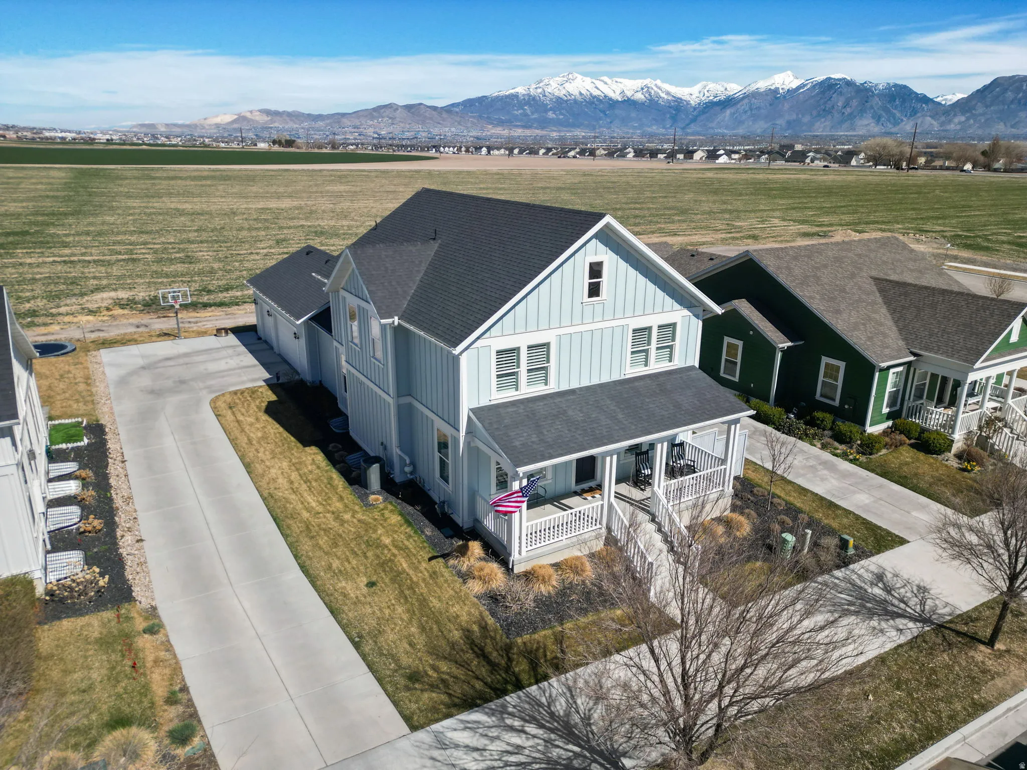 Aerial view of sparsely populated area with a mountainous background
