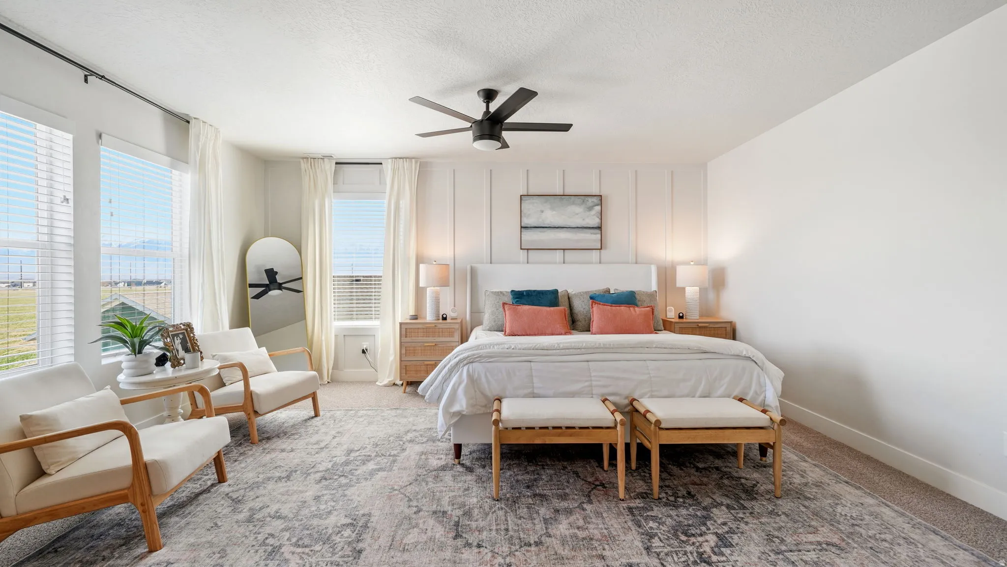 Bedroom featuring carpet, ceiling fan, and a textured ceiling