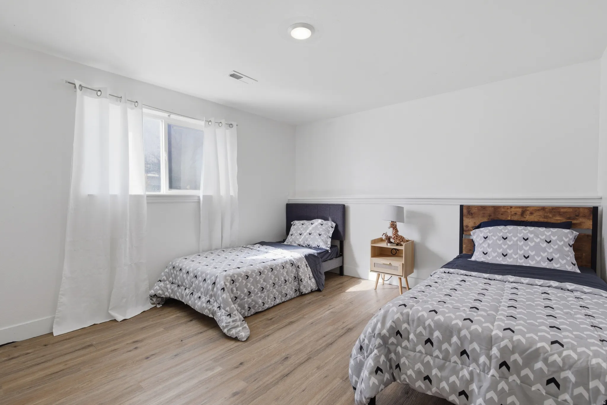 Bedroom with light wood-type flooring