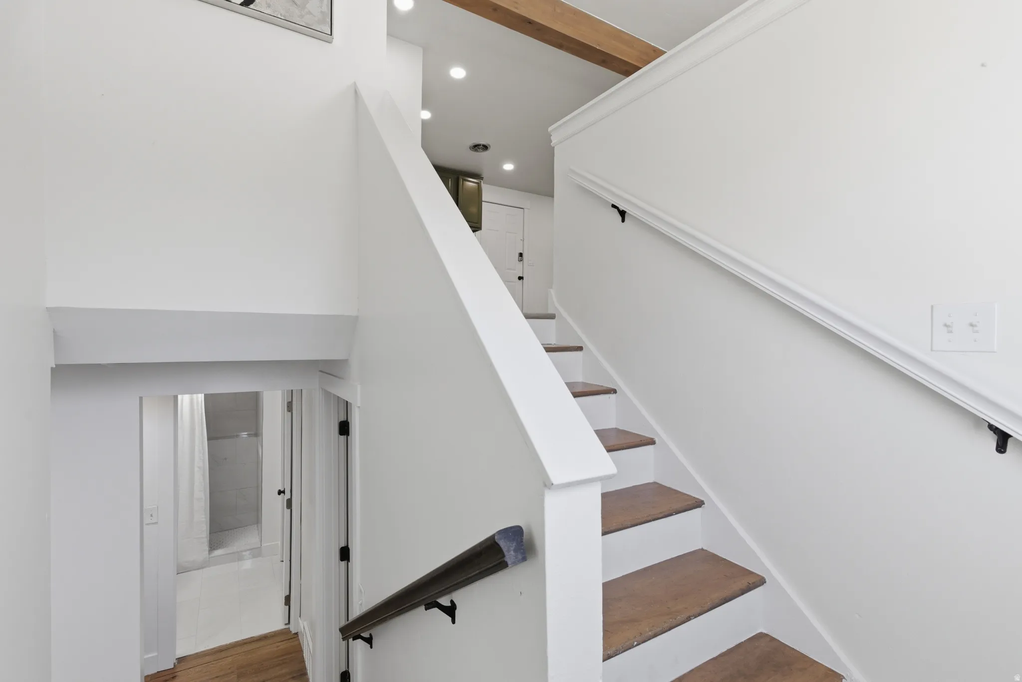 Staircase featuring recessed lighting