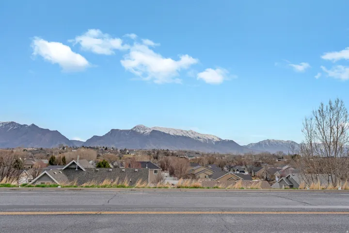 View of mountain background featuring nearby suburban area