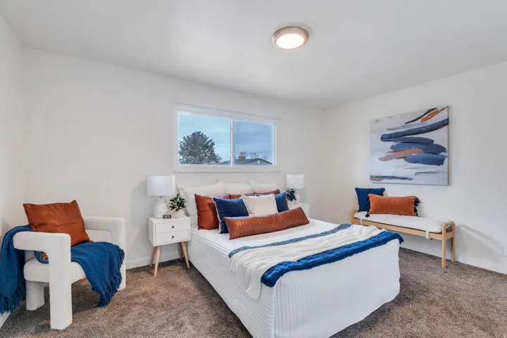 Carpeted bedroom with baseboards