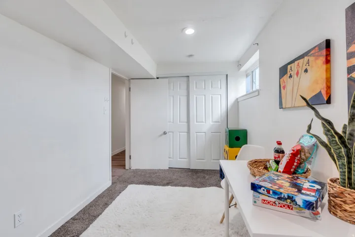 Playroom featuring light colored carpet and baseboards