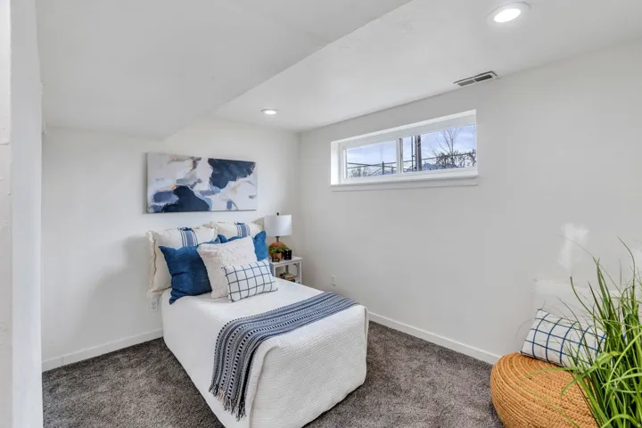 Bedroom featuring dark colored carpet and recessed lighting