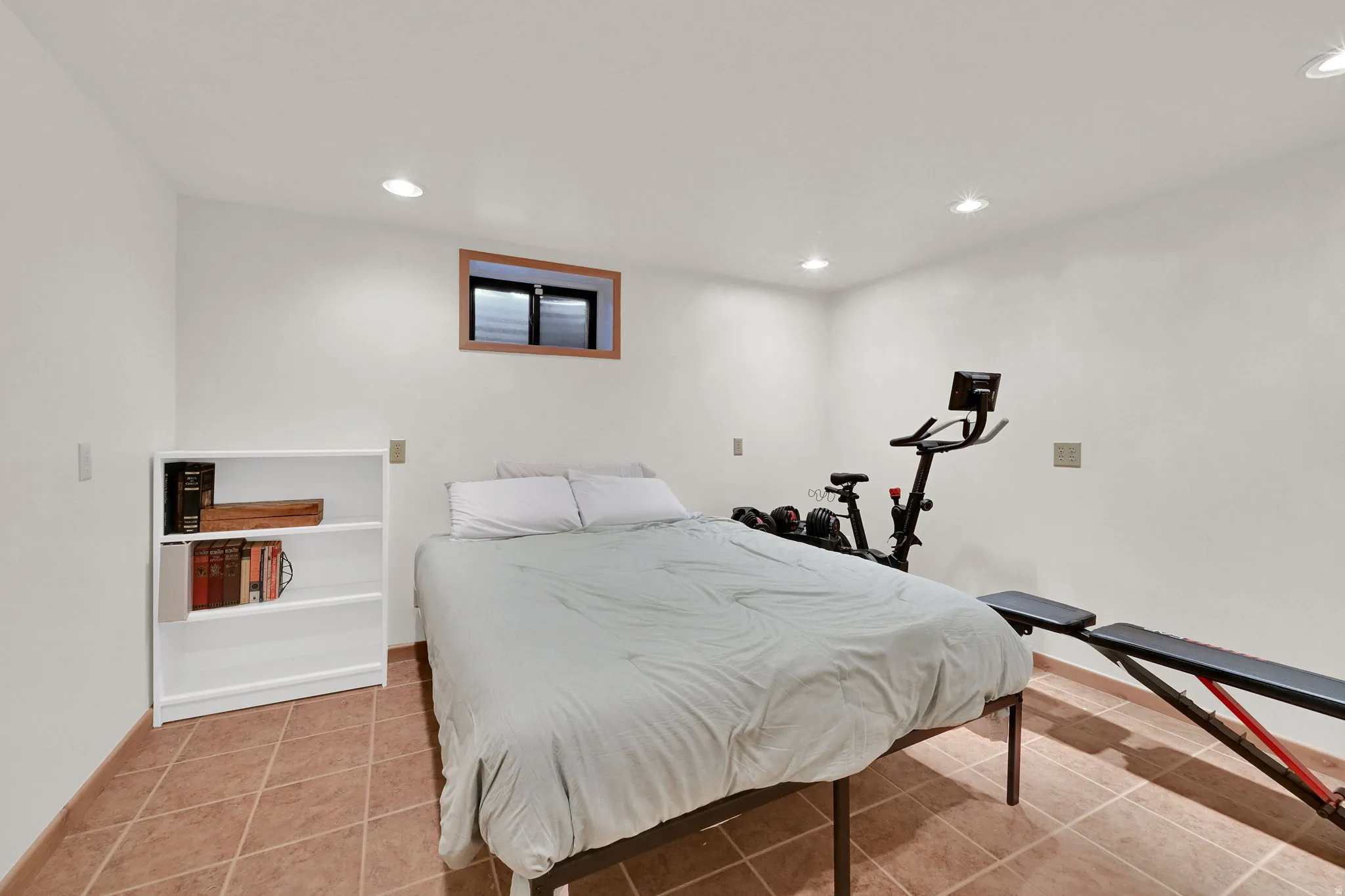 room with recessed lighting and light tile patterned floors