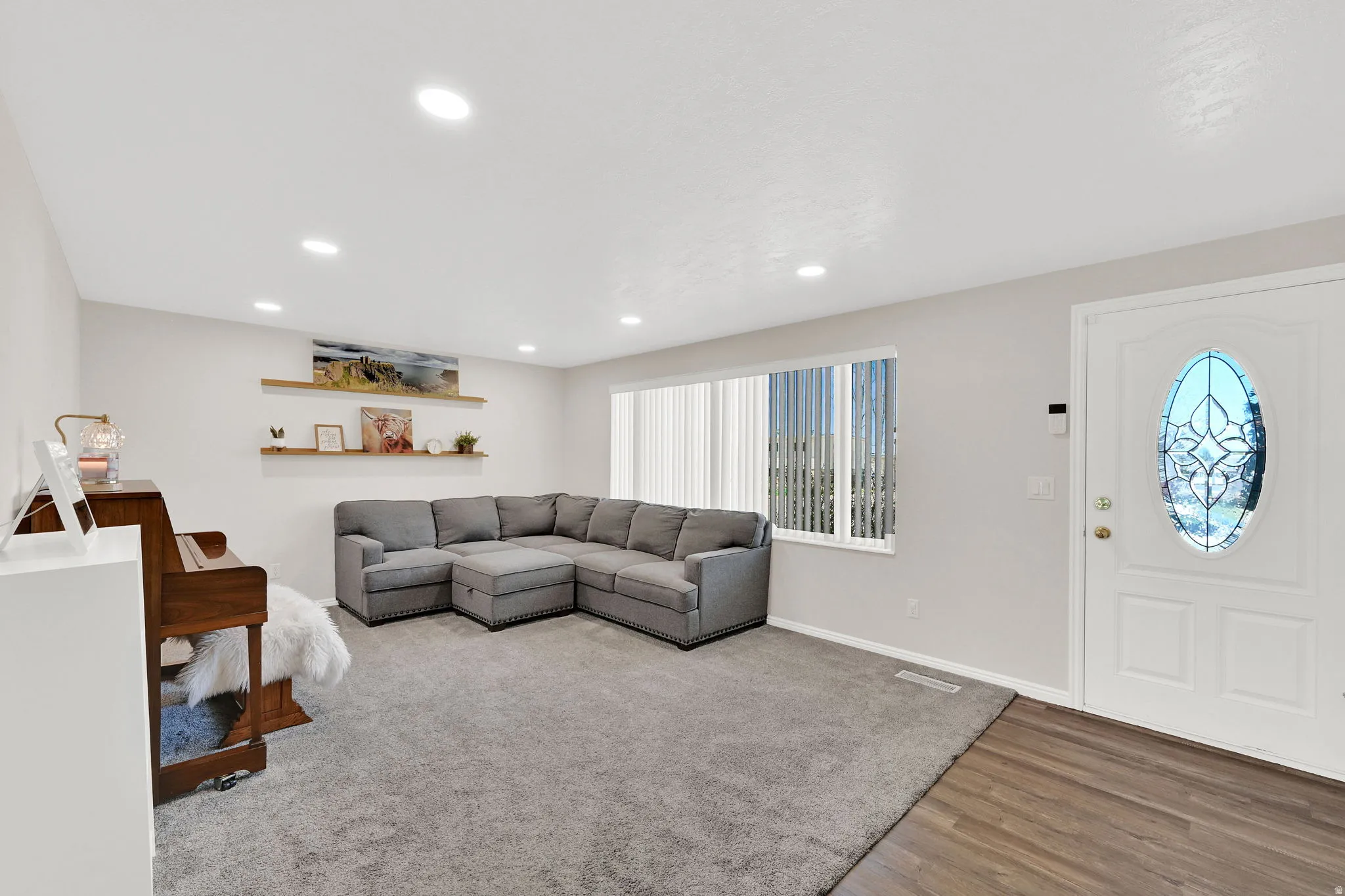 Living room featuring recessed lighting and light wood-style floors