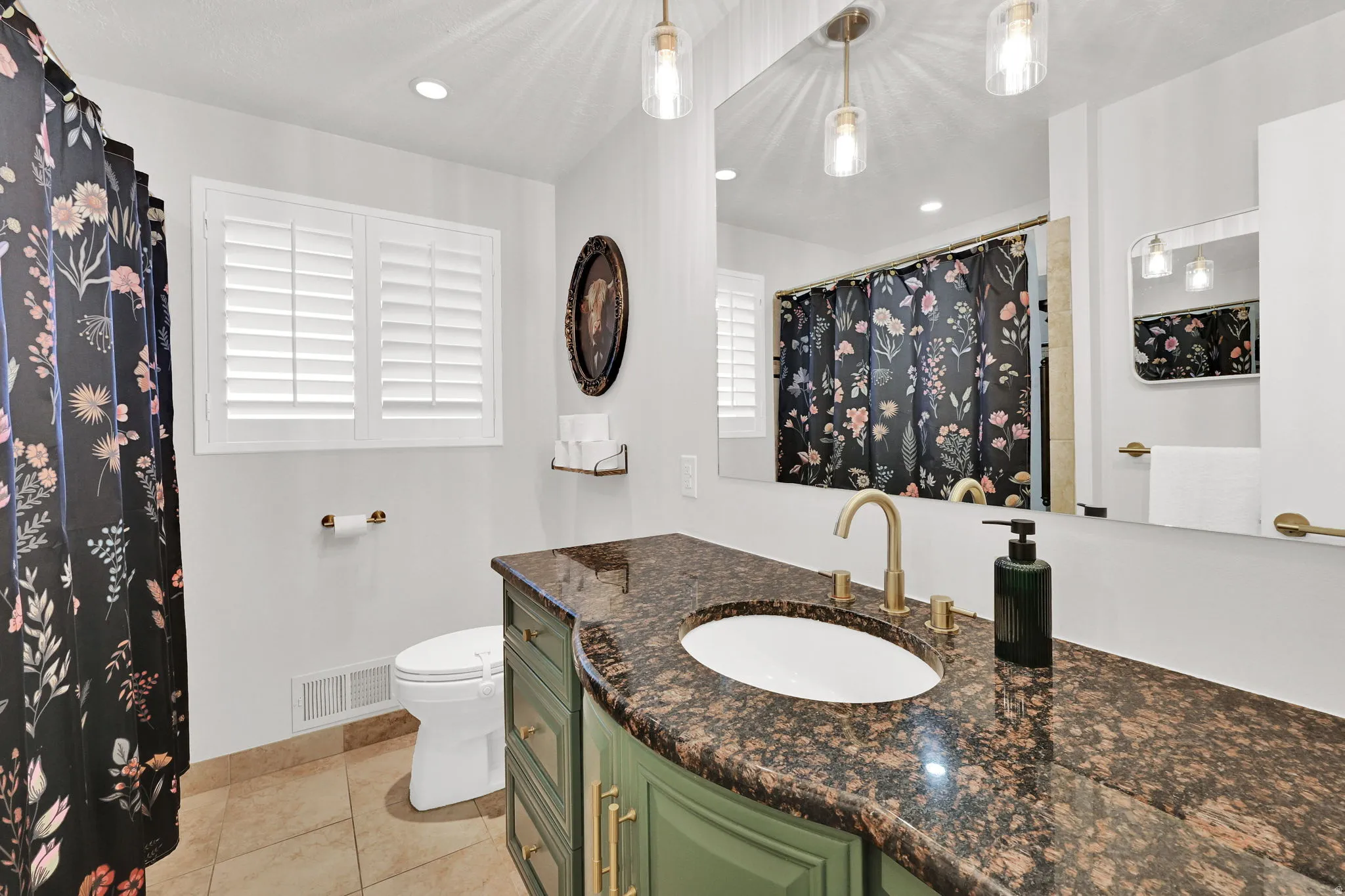 Bathroom featuring vanity, a shower with curtain, light tile patterned floors, and recessed lighting
