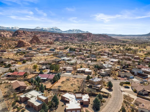 Aerial view of residential area with a mountainous background