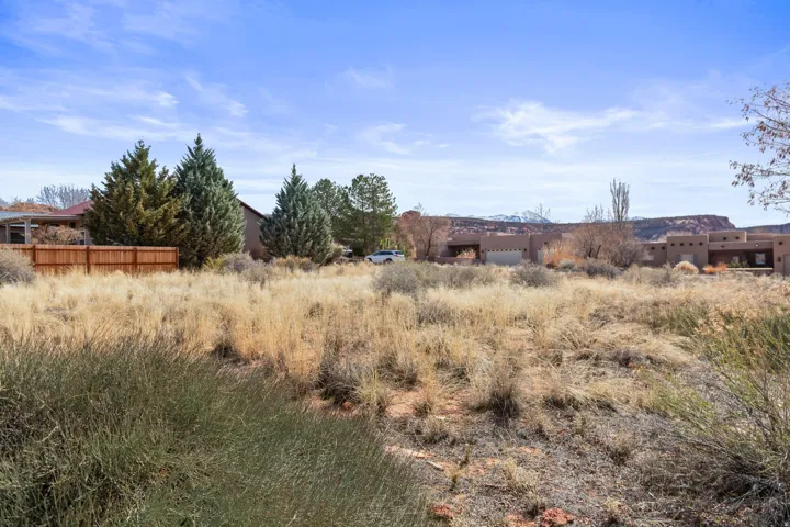 View of yard featuring a view of countryside and a garage